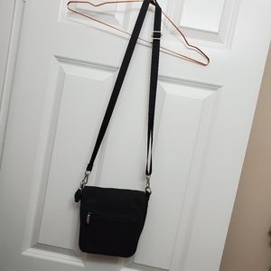 Travelon Brand, Cross Body, Small Purse. Black. Lots of compartments.
